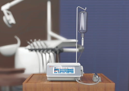 Woodpecker Implanter dental implant motor with a high-resolution touchscreen interface, an ergonomic handpiece, a transparent irrigation bottle, and a foot pedal. Designed for precise implant placement, bone drilling, and sinus lifting with a silent peristaltic pump for smooth operation.
