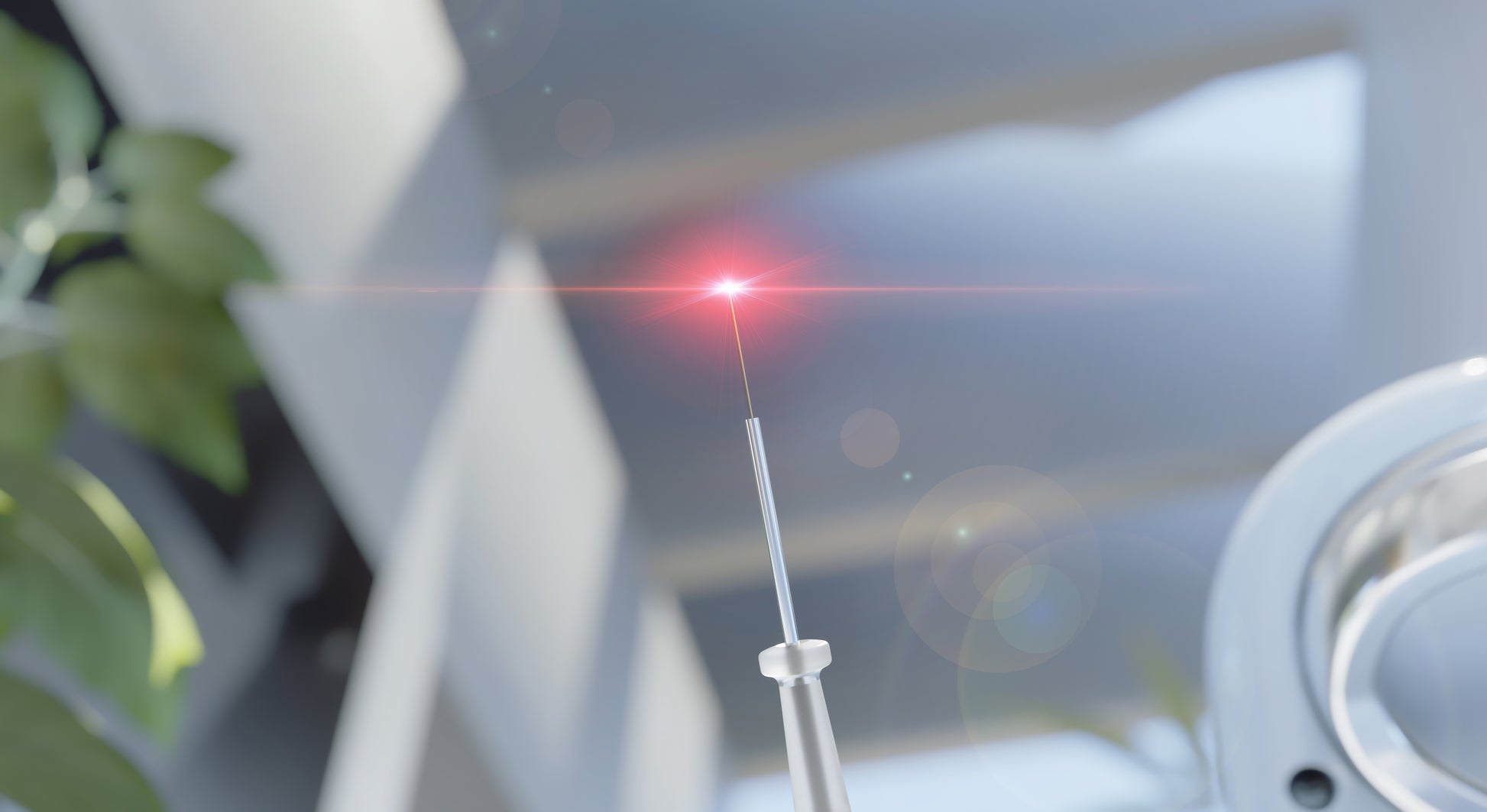 Close-up of the Woodpecker LX16 Plus dental laser handpiece emitting a focused red laser beam. The precision laser tip is designed for soft tissue treatments such as gingivectomy, frenectomy, and periodontal procedures. Captured in a modern clinical setting with a blurred background, highlighting advanced dental technology.