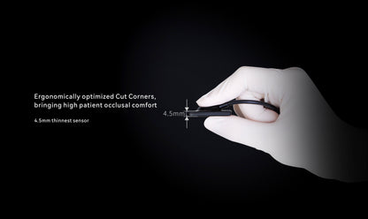 Gloved hand holding the ultra-thin 4.5mm i-Sensor, demonstrating its ergonomic design with optimized corners for improved patient comfort during dental imaging.